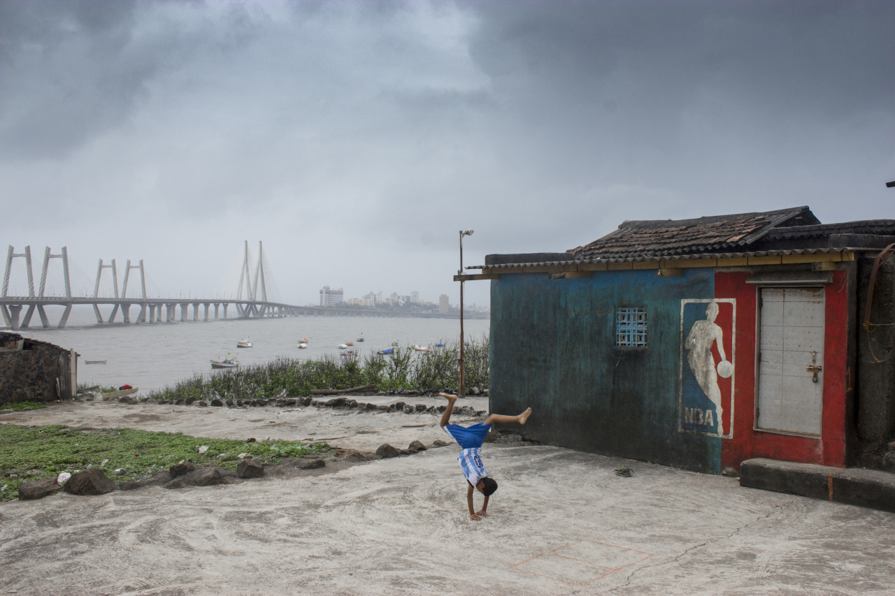 A boy demonstrates his acrobatic skills at Worli Koliwada, Mumbai.
The word ‘Koliwada’ roughly translates to a ‘village or colony of the Koli community’. Worli Koliwada is one of the seven original islands that made up Bombay until they were all...